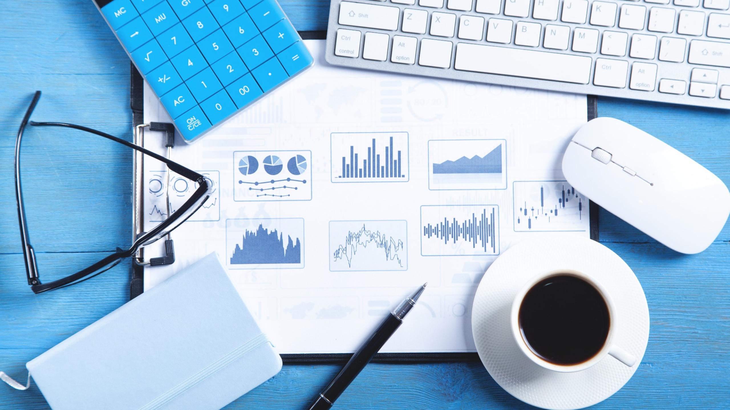 business-graphs-computer-keyboard-coffee-pen-eyeglasses-business-analysis-accounting